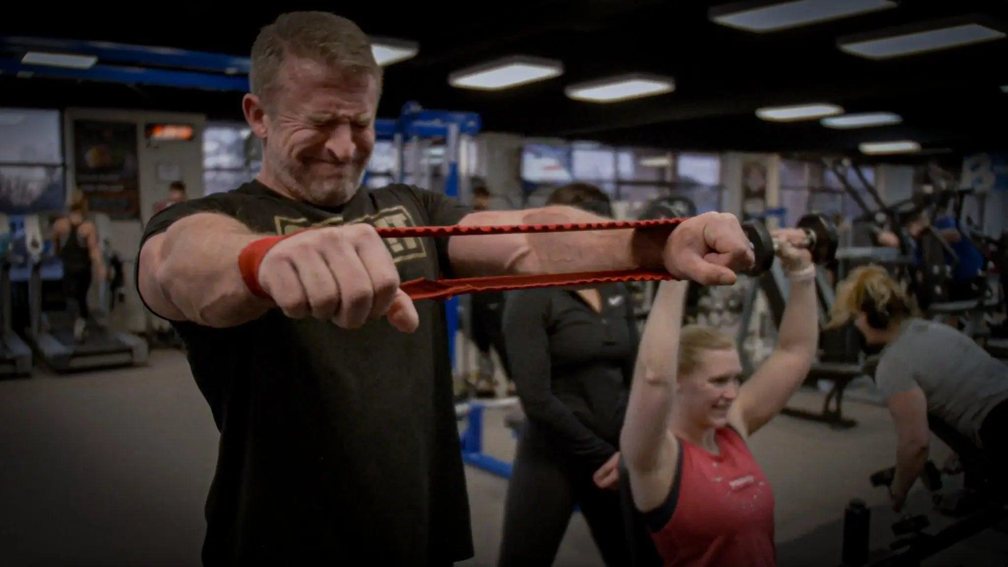 Chet Nichols performing a shoulder exercise during his massive shoulder day workout